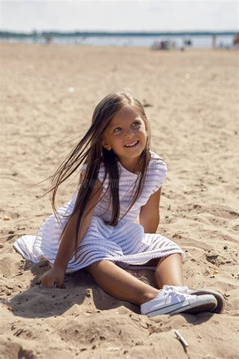 Portrait Of A Tanned Girl On The Sandy Beach Stock Photo Image Of