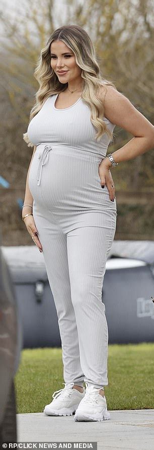 Pregnant Georgia Kousoulou Cradles Her Burgeoning Belly Daily Mail Online