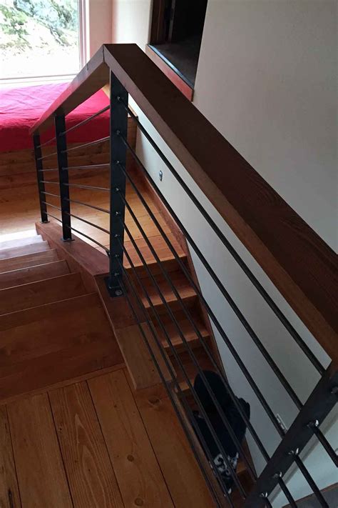 These parts have such strange shapes that are far from the usual shapes worked by the average wood worker that they seem extremely difficult and complicated to. Photo: Raw Steel Handrail Featuring Wood Cap. | Steel handrail, Stairs, Staircase design
