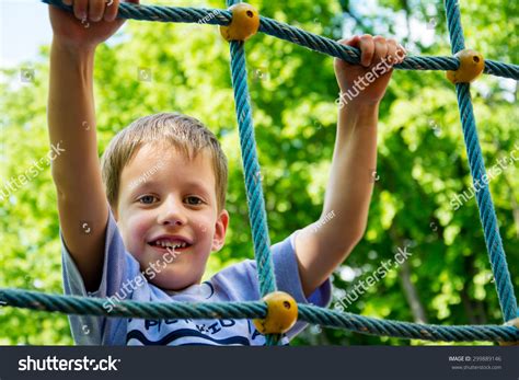 Young Boy Climbing Rope Obstacle On Stock Photo 299889146 Shutterstock