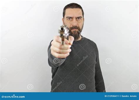 Man Holding Gun Pointing And Looking At The Camera Stock Image Image