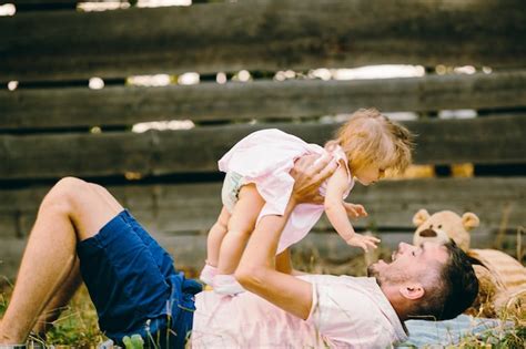 Free Photo Father Playing With His Young Daughter