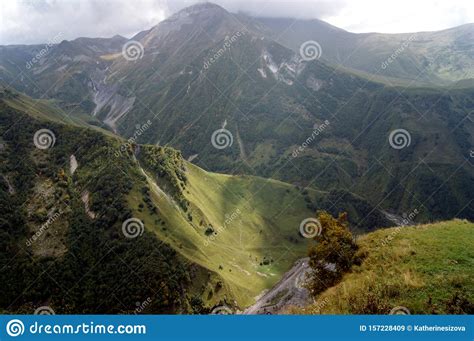 Spectacular Green Mountain Landscape On Sunny Day With Snow Mountain