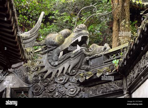 Traditional Chinese Dragon On Wall Old Architecture In Yu Yuan Gardens