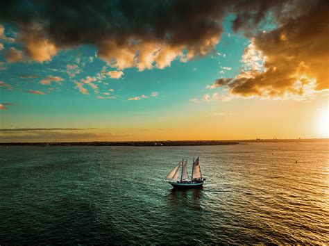 Sailboat Sunset Photograph By Wes Shinn Fine Art America