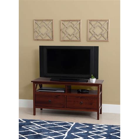 The tv tower features four shelves that provide ample storage and display space. Linon Titian Wood TV Stand in Brown - 86158ATOB-01-KD-U