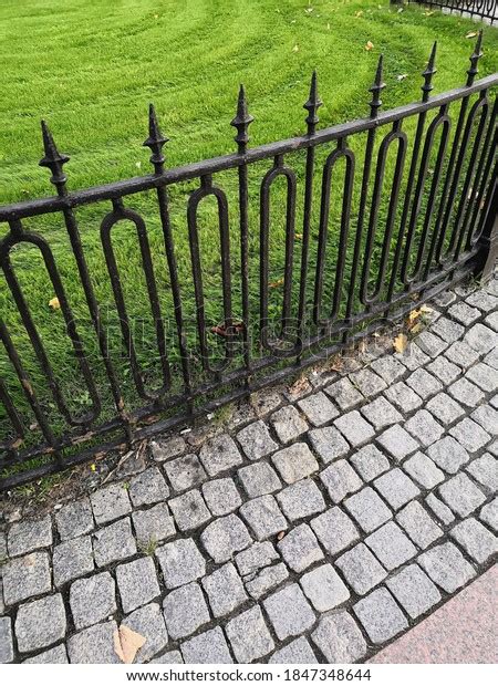 Cobblestone Pavement Metal Garden Fence Against Stock Photo 1847348644
