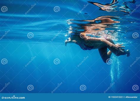 Women Snorkeling In The Tropical Sea Underwater Women Stock Photo
