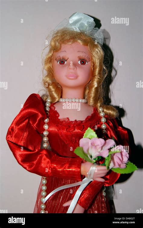 Doll Girl Holding Flower Hi Res Stock Photography And Images Alamy