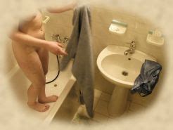 Spy Cam Shots Of Unsuspecting Babe Caught Taking A Shower Porn Pictures