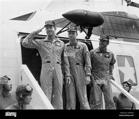 The Apollo 15 Astronauts Disembark Their Helicopter Aboard The Uss