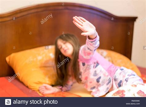 Cute Little Girl Stretching Her Arms Happily With A Smile From Waking