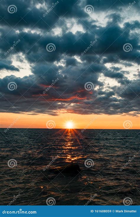 Simple Clean Sunset Portrait With Blue And Orange Color Scheme Stock