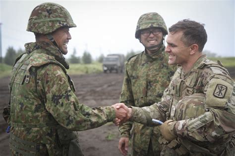 Battalion Commanders Shake Hands After Successful Planning And