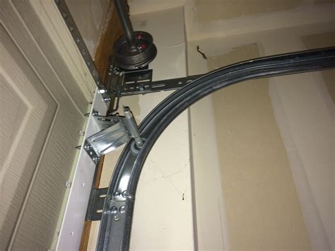 Our expert garage door repair technicians are experience and available 24/7 to tackle any garage door repair from remote programming through broken garage. Photo- Finished Garage Door Cable Repair