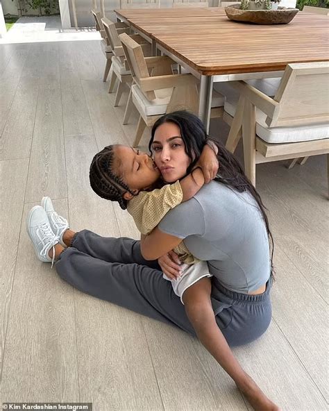 kim kardashian shares series of sweet snaps as she cuddles son saint five daily mail online