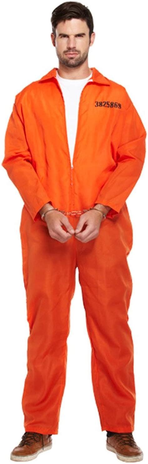 A Man In An Orange Jumpsuit Is Standing With His Hands On His Hips And