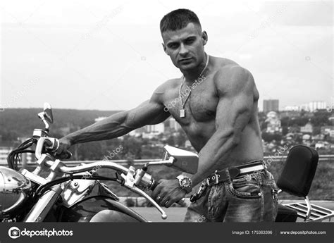 Athletic Muscular Man With Naked Torso Near His Motorcycle Stock Photo