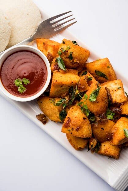 Premium Photo Masala Fried Idlies South Indian Snack Made Using With Leftover Idly Served