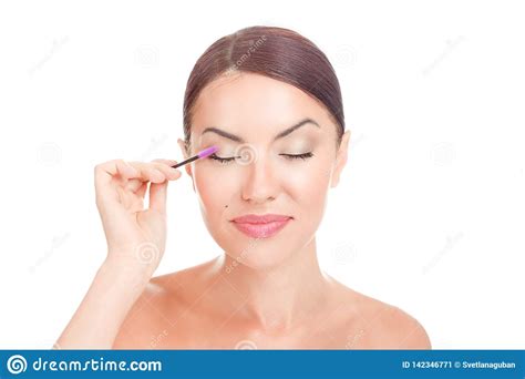 Woman Applying Eyelash Serum Essential Oil On Eyelashes With Makeup