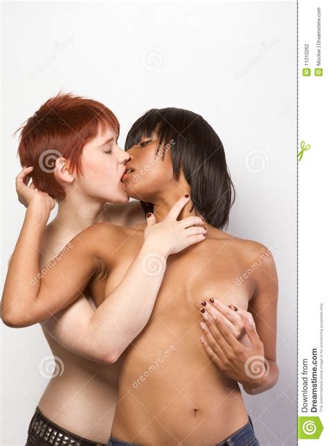 Young Interracial Lesbian Couple In Love Kissing Stock