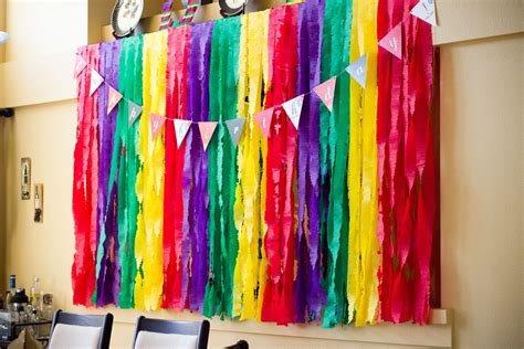 Pastel party streamers and balloon garland backdrop. DIY Fringed Streamer Backdrop | Supal Desai