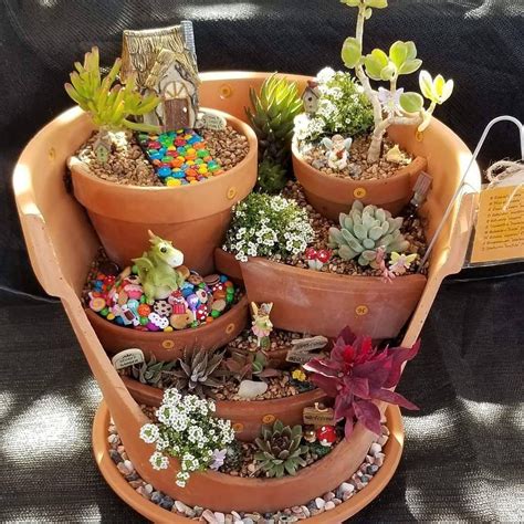 People Are Upcycling Broken Flower Pots Into Fairy Planterspainted
