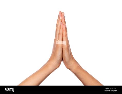 Female Hands Folded Together Isolated On A White Background Stock Photo
