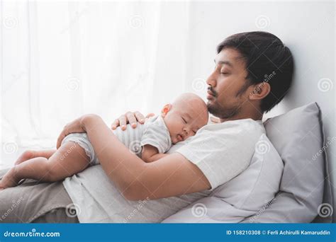 Dad With His Infant Boy Sleeping On His Chest Stock Photo Image Of