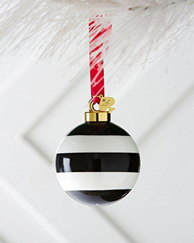 A Black And White Ornament Hanging From A Christmas Tree