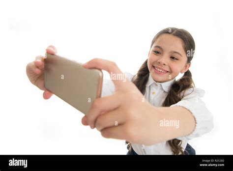 let me take selfie girl cute long curly hair holds smartphone taking selfie white background