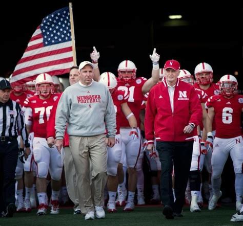 Coach Osborne Leading The Huskers Out Of The Tunnel One Final Time In