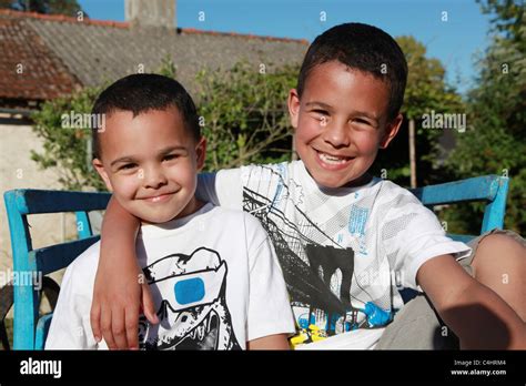 2 Mixed Race Brothers Smiling At The Camera Stock Photo Alamy