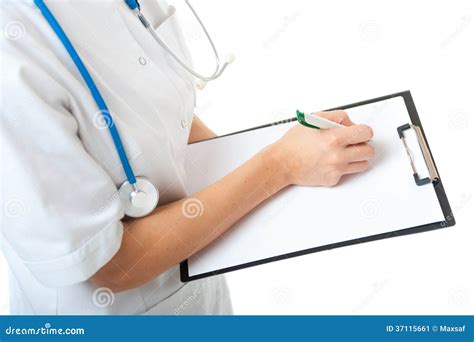 Female Doctor With Stethoscope Writing On Blank Clipboard Stock Image