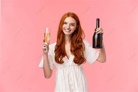 redhead woman cheers with champagne in celebration party adult celebration photo background and
