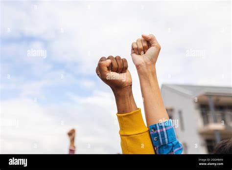 Diverse People Raising Their Fists At A Protest March Stock Photo Alamy