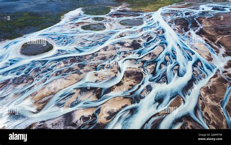 Aerial View Of Abstract Glacier Rivers Pattern Flowing On Icelandic