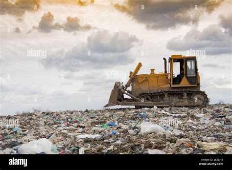 Bulldozer Compactor Working In Landfill Of Waste Stock Photo Alamy