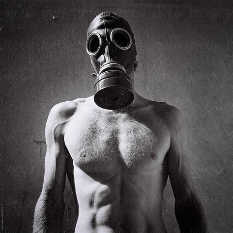 post apocalyptic man in gas mask stocksy united