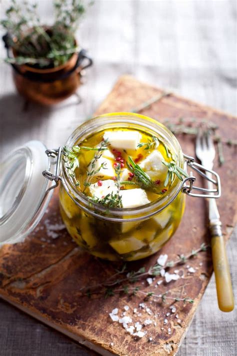 Cheese Marinated In Olive Oil With Herbs Stock Photo Image Of Metal