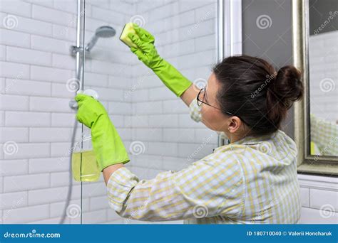 Female Washing Soaped Hands Under Turned On Water In Bathroom Stock