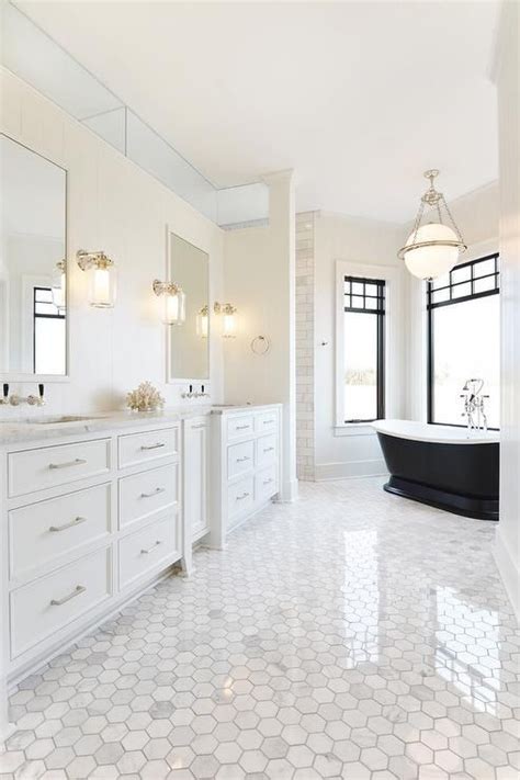 Maybe you would like to learn more about one of these? Elegant white bathroom with black accents is fitted with a ...