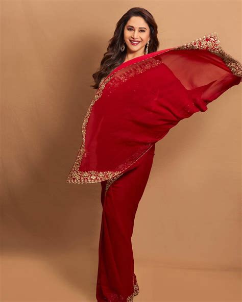 Madhuri Dixit Looks Her Graceful Best As She Exudes Elegance In A Timeless Red Saree