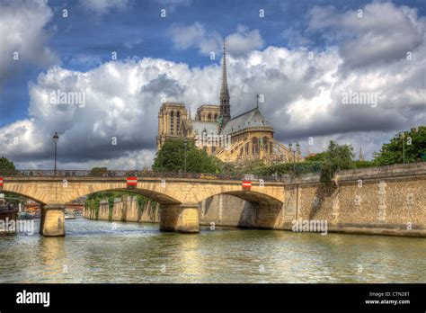 View On Notre Dame Cathedral Under Beautiful Sky With White Clouds In