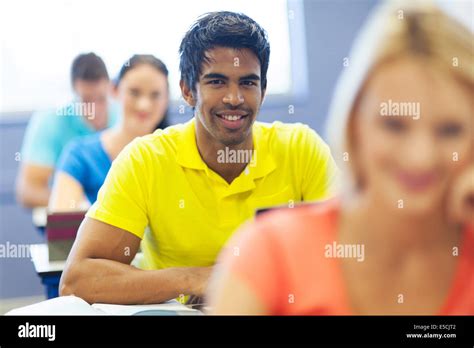 Handsome Male Indian College Student In Lecture Room With Classmates