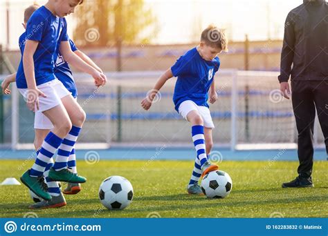 Kids Doing Sports Outdoor Soccer Training For Children Stock Photo