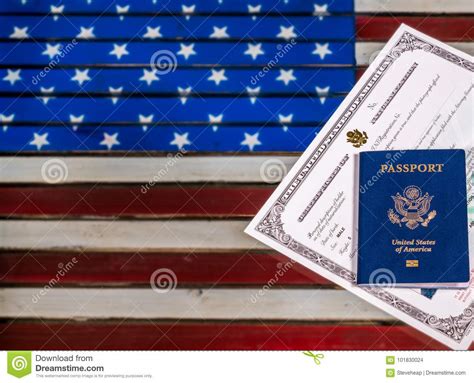 Usa Passport And Naturalization Certificate Over Us Flag Stock Photo