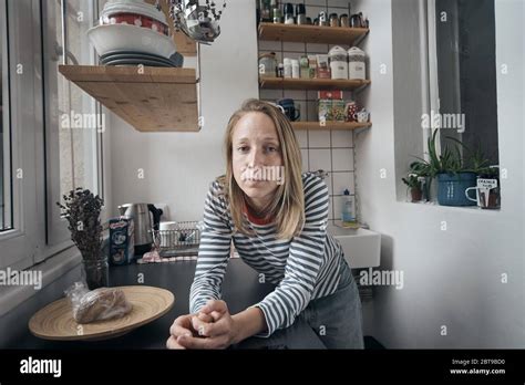 Environmental Portrait Of A Female Artist In Her Basement Apartment In