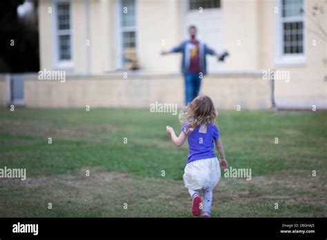 Daughter Running To Father Stock Photo Alamy