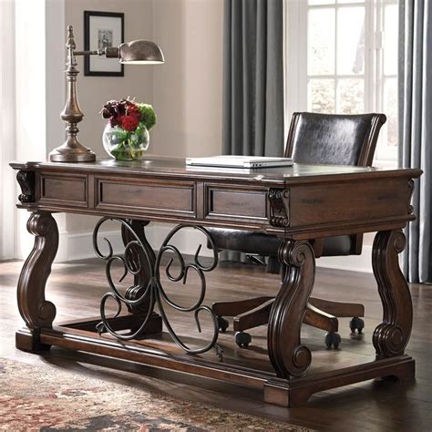 3.2 out of 5 stars14. The Alymere Home Office Desk from Ashley Furniture comes ...